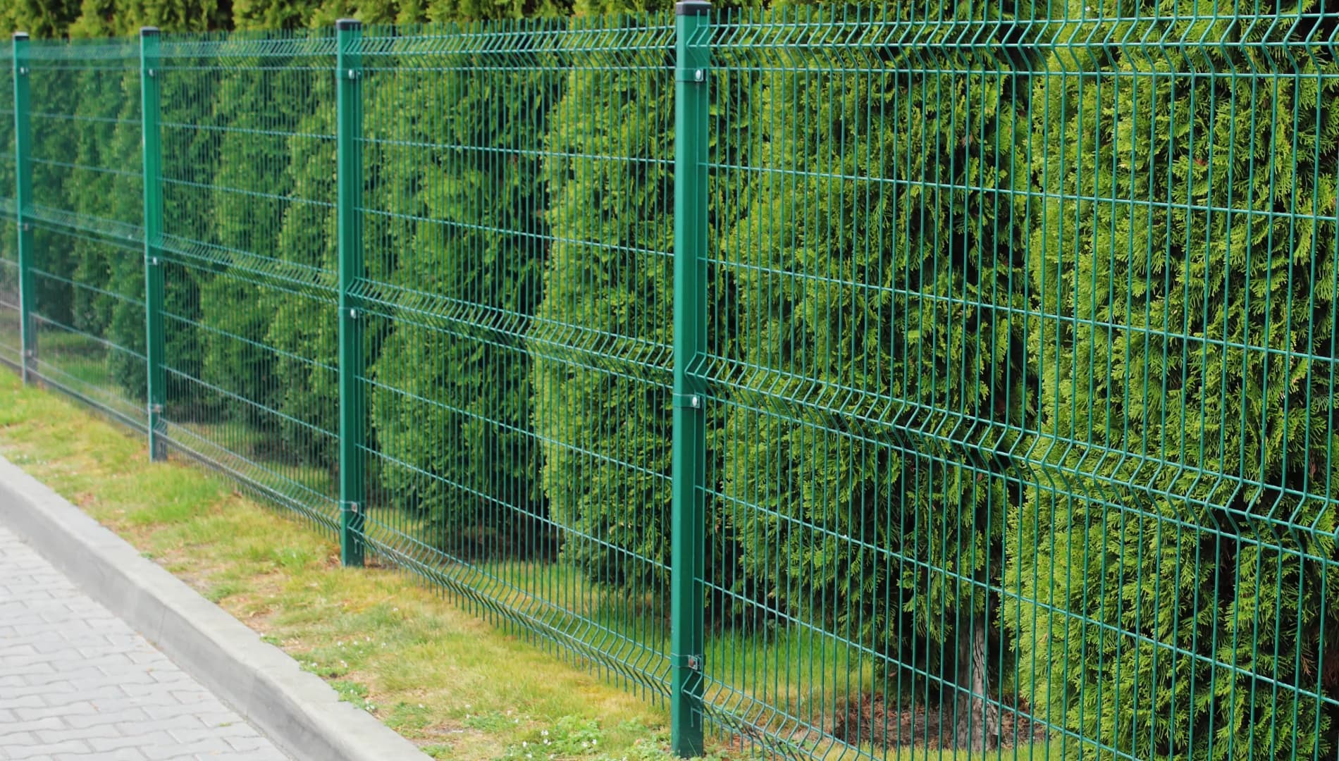 Galvanised mesh perimeter fencing around an industrial site